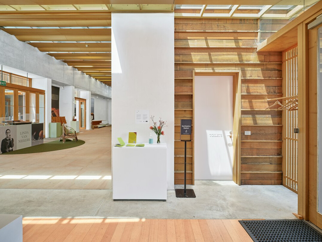Wide shot of a bright open plan studio office with people working